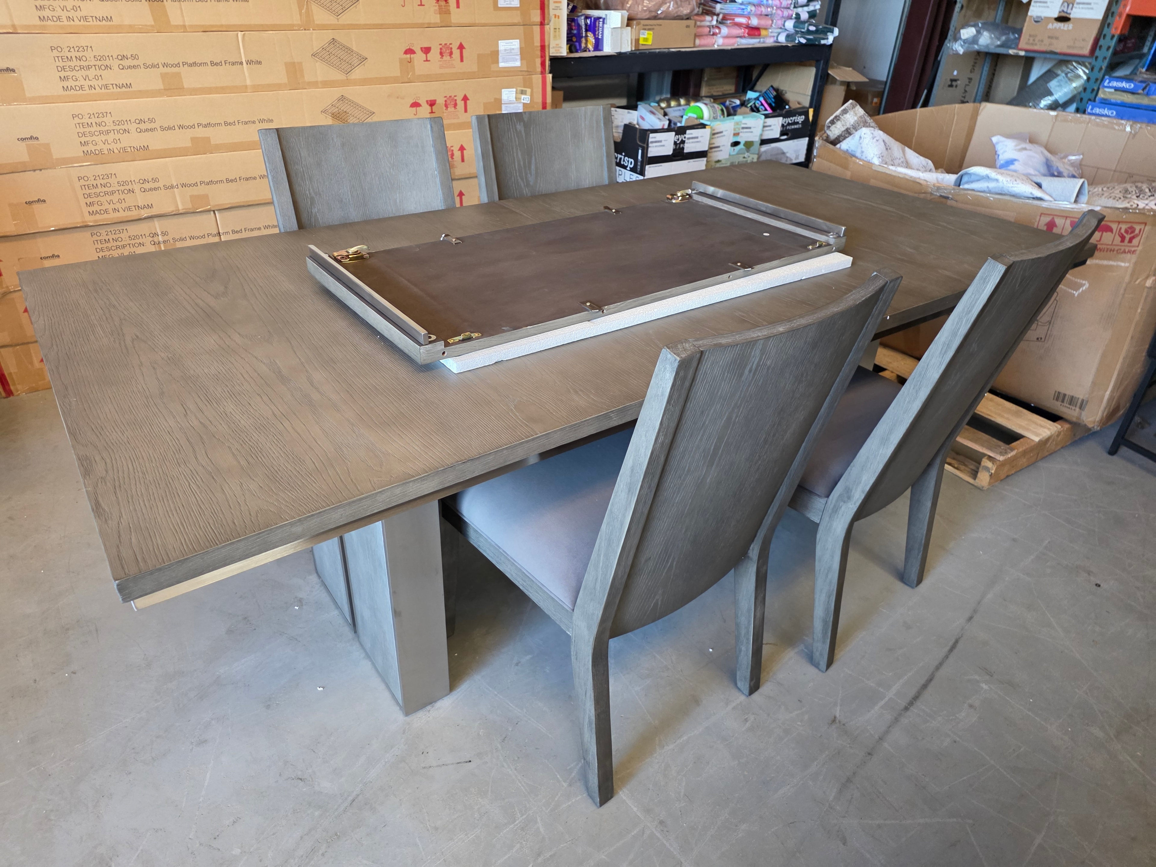 Neal Liquidations warehouse — dining furniture