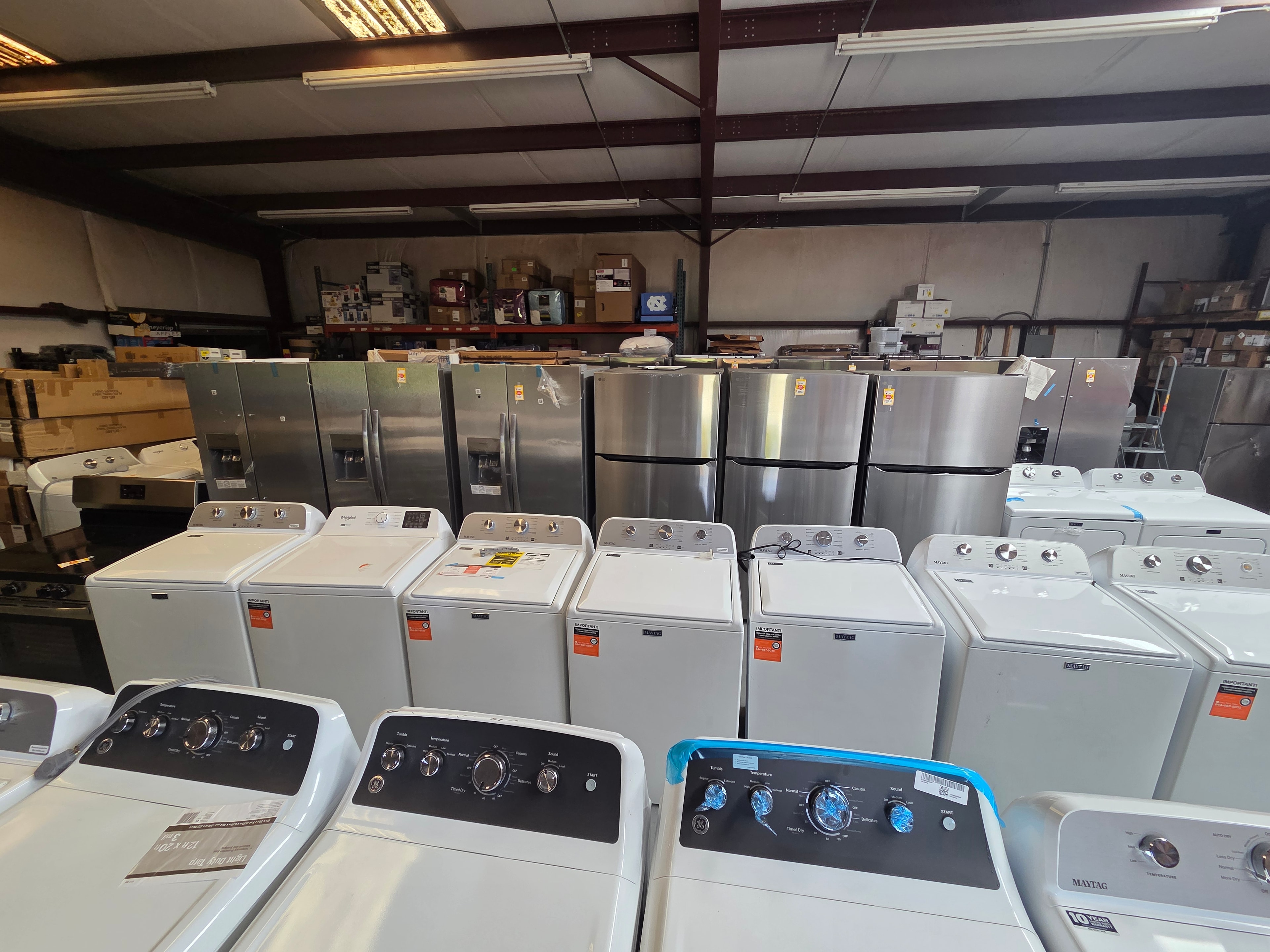 Neal Liquidations warehouse — washers, refrigerators, and dryers