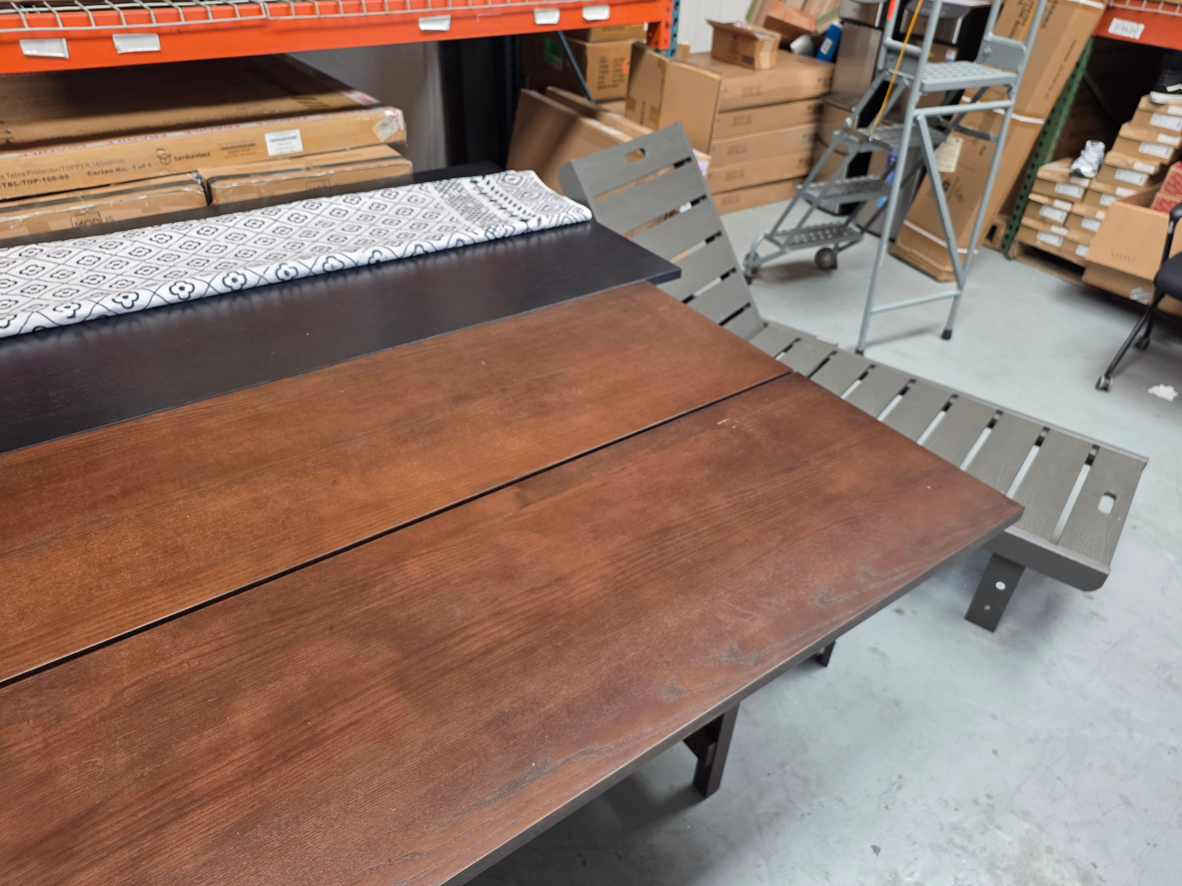Wood dining tables and outdoor furniture in warehouse
